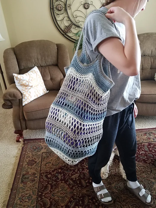 Woman wearing the On the Go Market Bag Crochet Pattern Free