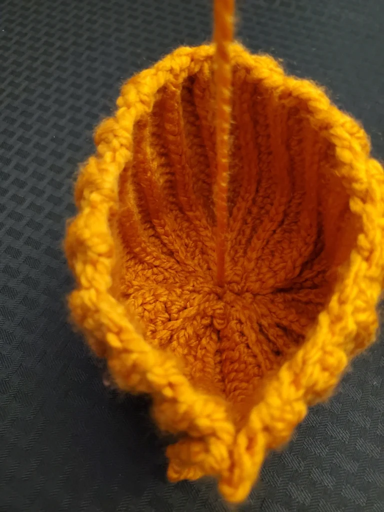 Sewing closed a ribbed pumpkin step 6