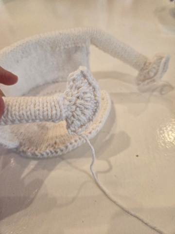 Adding hands to the Book Reader free knitting pattern toilet roll cover